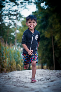 Portrait of boy running