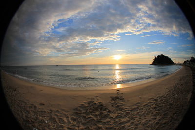 Scenic view of beach against sky during sunset