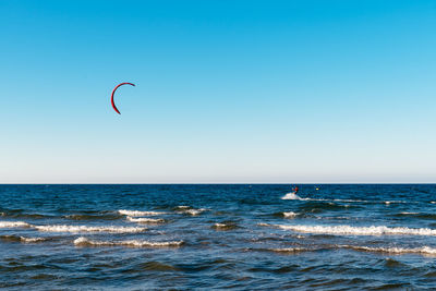 Man practicing kitesurf at the beach