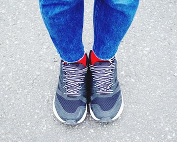 Low section of person standing on street