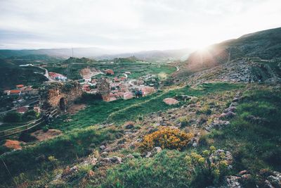 Scenic view of landscape against cloudy sky