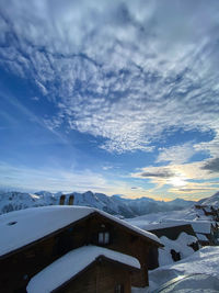 Scenic view of snowcapped mountains against sky during winter