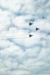 Low angle view of airplane flying against sky