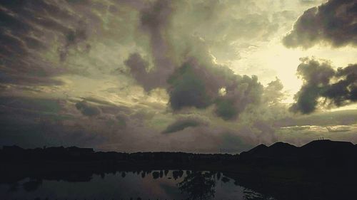 Scenic view of sea against cloudy sky