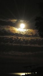 Low angle view of moon in sky at night