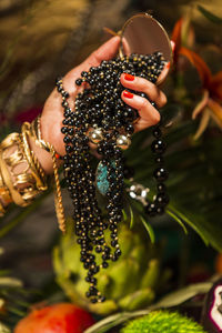 Close-up of woman hand holding cross