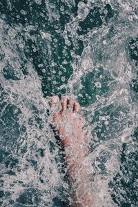 Water splash over my feet while the boat was going at a good speed during my vacation.