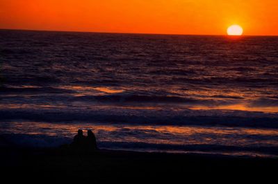 Scenic view of sea at sunset