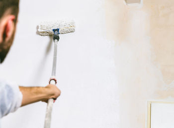 Man working on wall