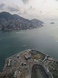 View of sea and buildings against sky