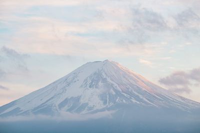 Snowcapped mountain against sky during winter