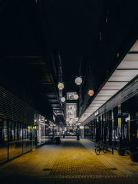 Illuminated railroad station at night,empty during covid-19