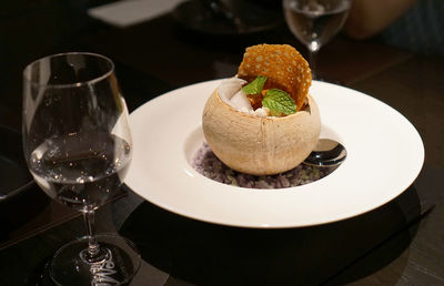 Close-up of beer served on table