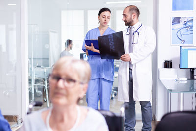 Portrait of doctor examining patient