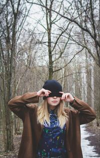 Woman standing in forest