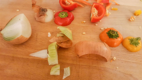 High angle view of vegetables on cutting board on table