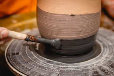 Cropped hand of man working at workshop