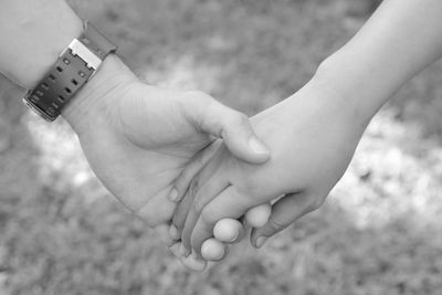 Close-up of woman holding hands