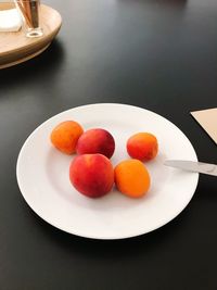 High angle view of fruits in plate on table