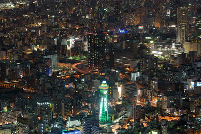High angle view of illuminated tsutenkaku tower in city at night