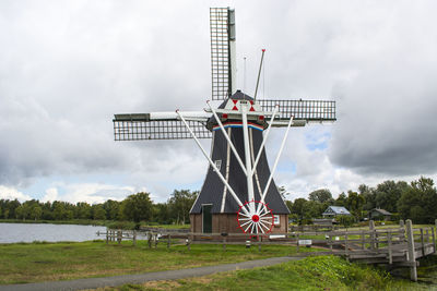 Traditional windmill against sky