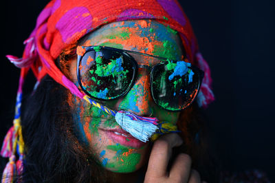 A young girl celebrating the festival of colours, holi.