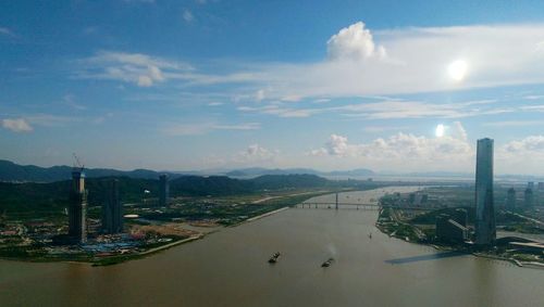 Panoramic view of city and buildings against sky