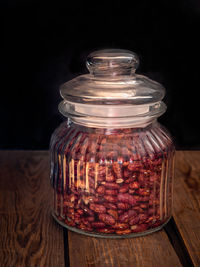 Close-up of glass jar on table