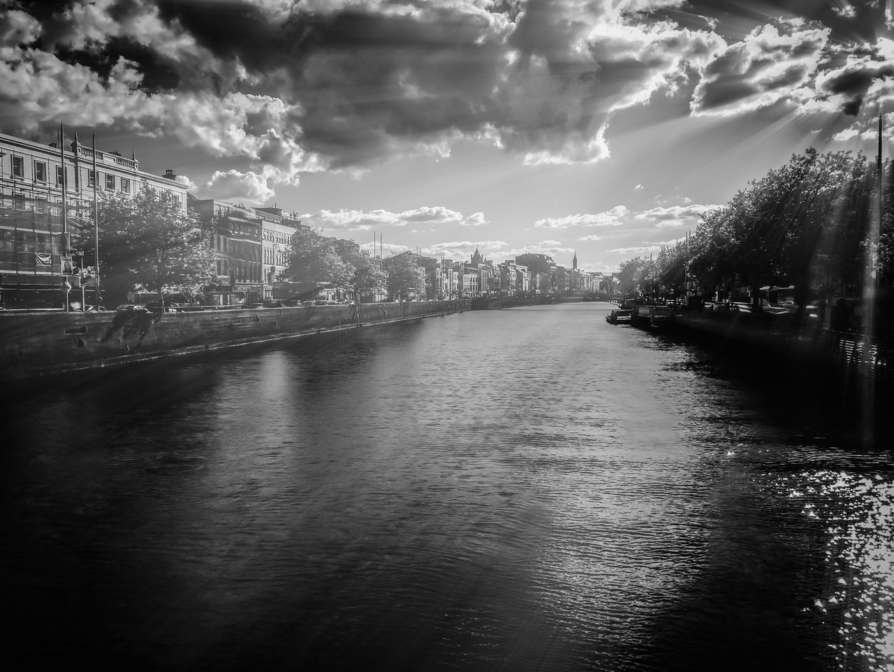 water, built structure, architecture, sky, waterfront, building exterior, cloud - sky, river, transportation, city, bridge - man made structure, connection, cloudy, rippled, diminishing perspective, cloud, outdoors, no people, nature, the way forward