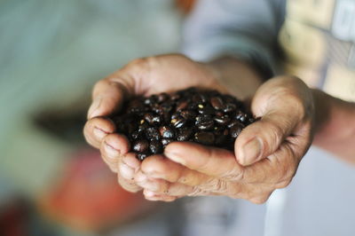 Midsection of man holding ice cream
