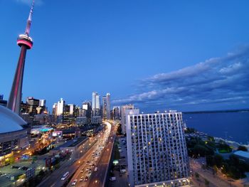 Aerial view of city street and buildings against sky