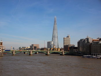 Southwark bridge over thames river against sky