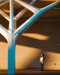 Full length of woman standing with umbrella