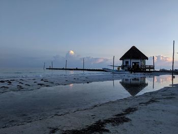 Scenic view of sea against sky at sunset