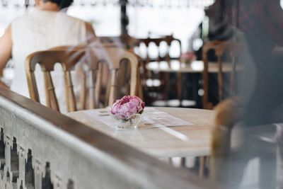 View of purple flower on table at restaurant