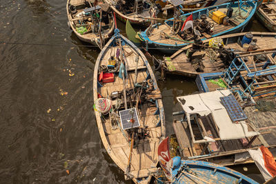 High angle view of fishing boats moored in lake