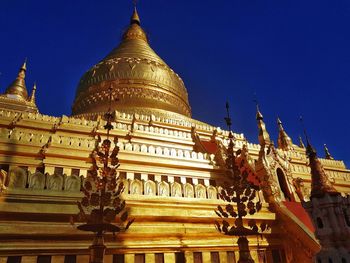 Low angle view of temple against building