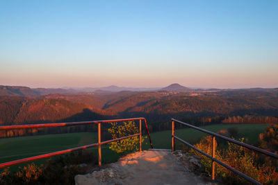 Scenic view of mountains against clear sky during sunset