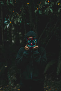 Man standing in forest