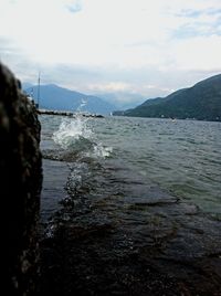 Scenic view of sea against cloudy sky