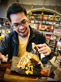 Portrait of smiling man holding ice cream