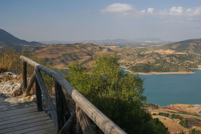 Scenic view of lake and mountains against sky