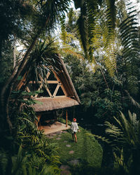 High angle view of woman walking towards villa