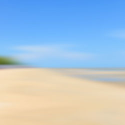 Scenic view of desert against clear blue sky