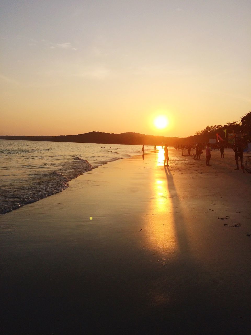 sea, beach, sunset, water, horizon over water, shore, scenics, sun, tranquil scene, beauty in nature, tranquility, sand, sky, idyllic, nature, incidental people, silhouette, orange color, vacations