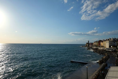 Scenic view of sea against cloudy sky