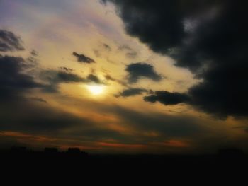 Low angle view of dramatic sky during sunset