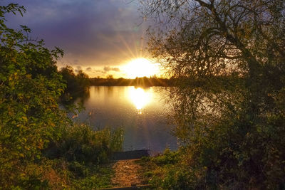 Scenic view of lake against sky during sunset