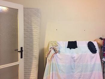 Close-up of clothes hanging at home