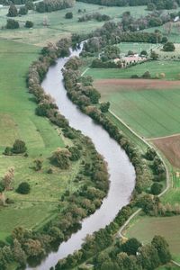 High angle view of river amidst field